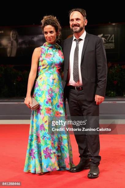 Paolo Pierobon from the movie 'L'Ordine Delle Cose' and Serena Iansiti walk the red carpet ahead of the 'The Insult' screening during the 74th Venice...