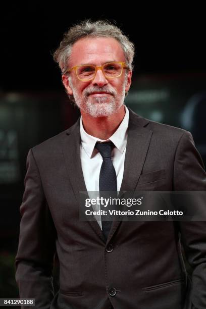 Fabrizio Ferracane from the movie 'L'Ordine Delle Cose' walk the red carpet ahead of the 'The Insult' screening during the 74th Venice Film Festival...