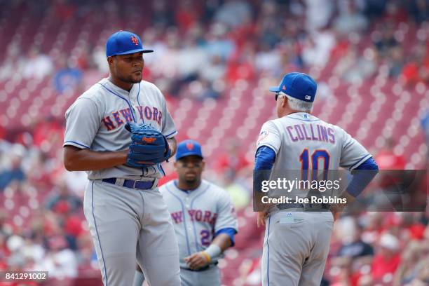 New York Mets manager Terry Collins walks to the mound to replace Jeurys Familia after a home run by Joey Votto of the Cincinnati Reds in the seventh...