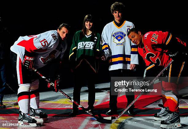 Jarome Iginla of the Calgary Flames and Dany Heatley of the Ottawa Senators participate for a ceremonial puck drop in celebration of the Mac's Midget...