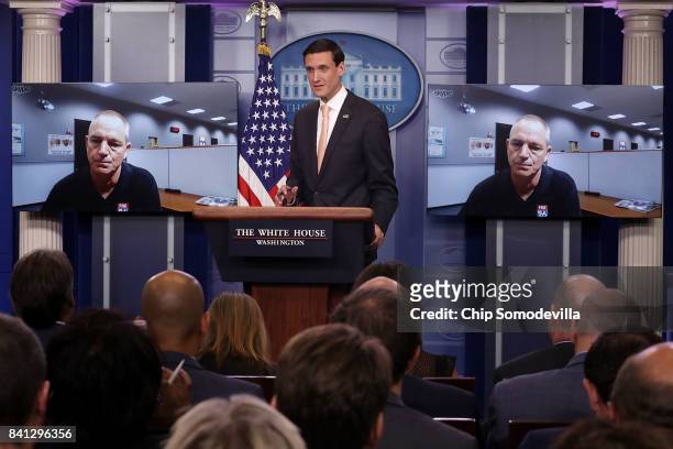 White House Homeland Security Advisor Tom Bossert answers a question from a reporter in Texas via Skype during a news conference in the Brady Press...
