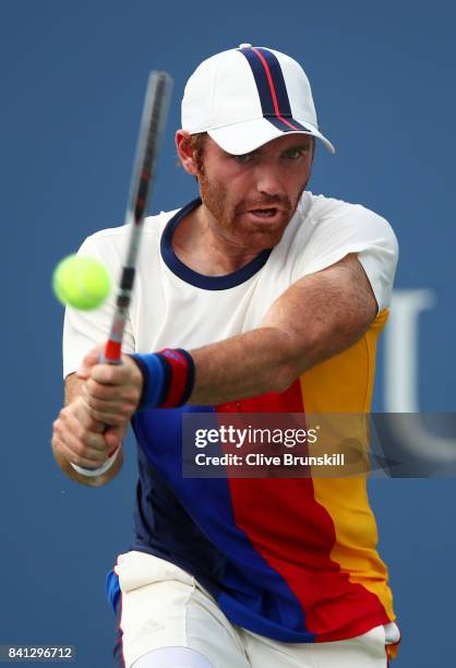 Bjorn Fratangelo of the United States returns a shot against Adrian Mannarino of France during their second round Men's Singles match on Day Four of...