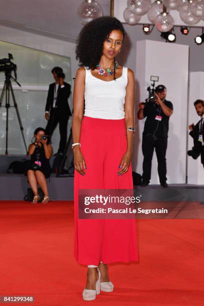 Yusra Warsama from the movie 'L'Ordine Delle Cose' walk the red carpet ahead of the 'The Insult' screening during the 74th Venice Film Festival at...