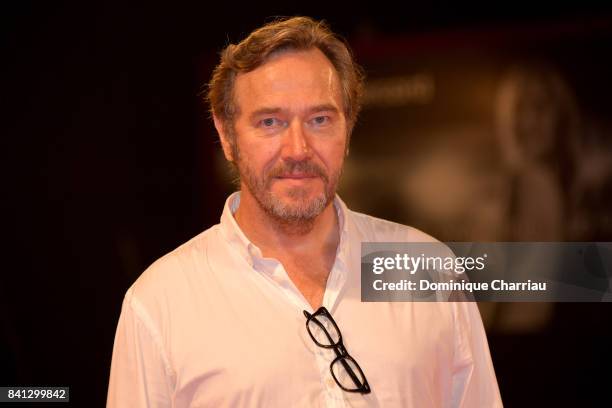 Olivier Rabourdin from the movie 'L'Ordine Delle Cose' walk the red carpet ahead of the 'The Insult' screening during the 74th Venice Film Festival...