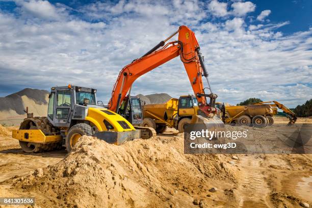 road construction machinery on the construction of highway - construction vehicle stock pictures, royalty-free photos & images