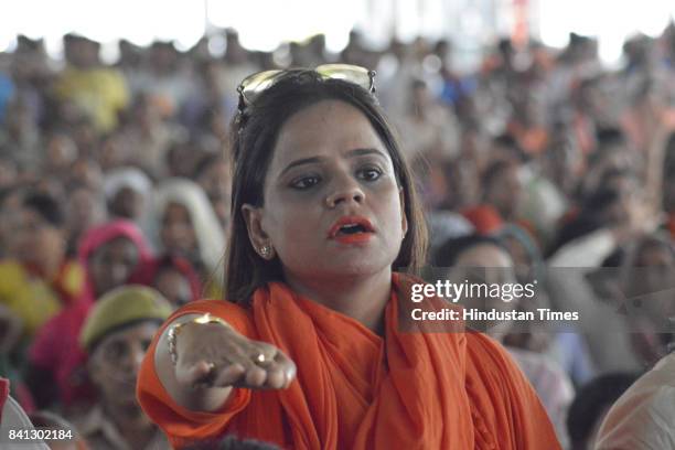 Party workers and supporters during the inauguration of the Kailash Mansarovar Bhawan by UP CM Yogi Adityanath at Kavi Nagar Ramlila Ground on August...