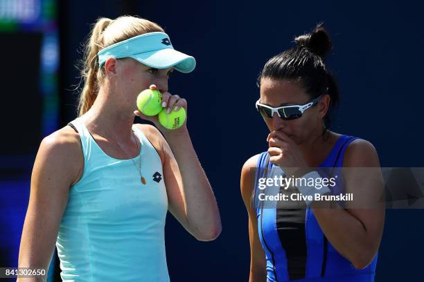 Naomi Broady of Great Britain and Darija Jurak of Croatia reacts against Mona Barthel and Carina Witthoeft of Germany during their first round...