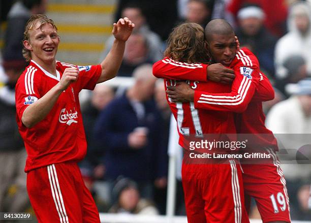 Ryan Babel of Liverpool celebrates scoring the third goal with Lucas Leiva and Dirk Kuyt during the Barclays Premier League match between Newcastle...
