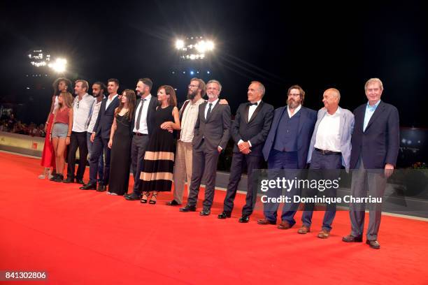 The Cast of the movie 'L'Ordine Delle Cose' walks the red carpet ahead of the 'The Insult' screening during the 74th Venice Film Festival at Sala...