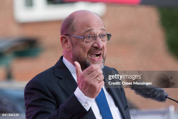 Martin Schulz, chancellor candidate of the German Social Democrats , speaks to voters at a "Martin Schulz live" election campaign stop on August 31,...