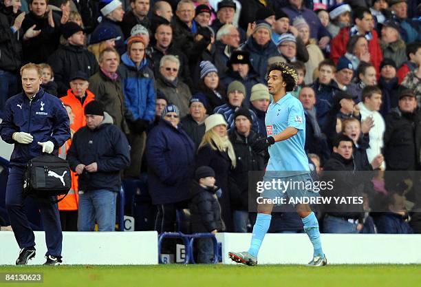 Tottenham Hotspur's Cameroonian defender Benoît Assou-Ekotto leaves the pitch after being sent off during the English Premier league football match...