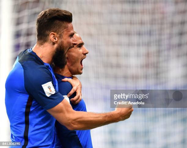 Antoine Griezmann of France celebrates with his team mate Olivier Giroud after scoring a goal during the FIFA World Cup 2018 qualifying Group A match...