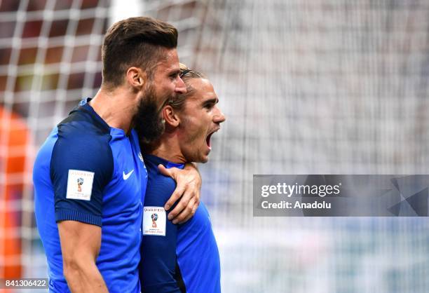 Antoine Griezmann of France celebrates with his team mate Olivier Giroud after scoring a goal during the FIFA World Cup 2018 qualifying Group A match...