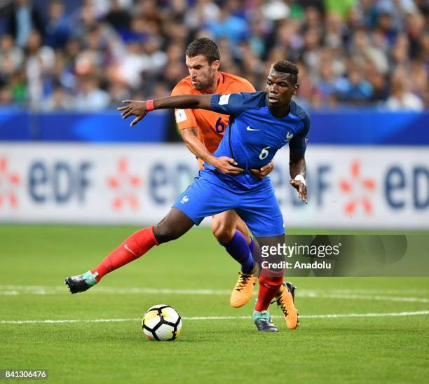 Paul Pogba of France in action against Kevin Strootman of Netherlands during the FIFA World Cup 2018 qualifying Group A match between France and...