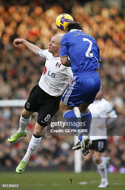 Fulham's English Striker Andy Johnson vies with Chelsea's Serbian Defender Branislav Ivanovic during their Premier League football match at Craven...