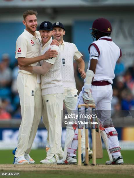 Stuart Broad of England is congratulated by Ben Stokes after Stokes catches Kieran Powell off Broad's bowling during the fifth day of the second test...