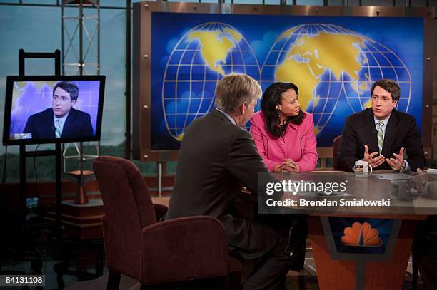 Moderator David Gregory and Michelle Singletary, financial columnist at the Washington Post, listen to Rich Lowry, editor of the National Review,...