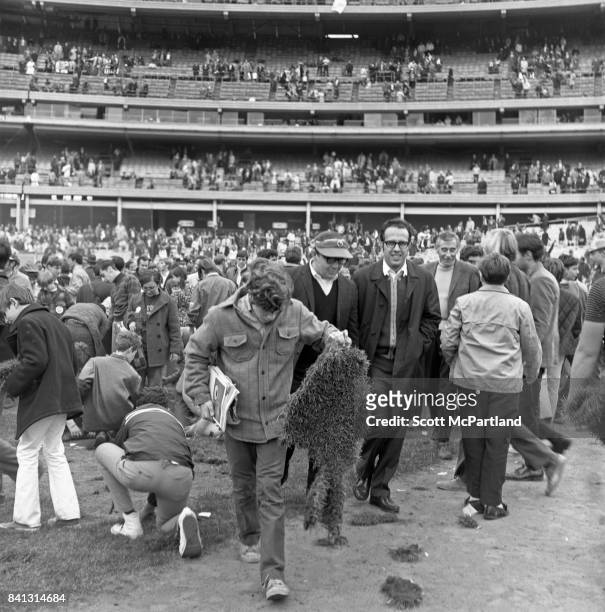 Shea Stadium : Fans get completely out of control and tear up large chunks of turf on the field, after the Mets win it all in Game 5 of the World...