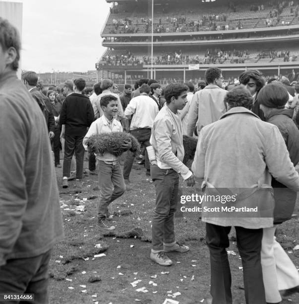 Shea Stadium : Fans get completely out of control and tear up large chunks of turf on the field, after the Mets win it all in Game 5 of the World...