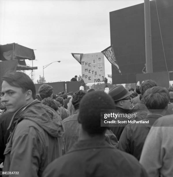 Shea Stadium : Fans storm the field, holding banners high in celebration of the Mets win in Game 5 of the 1969 World Series against the Baltimore...