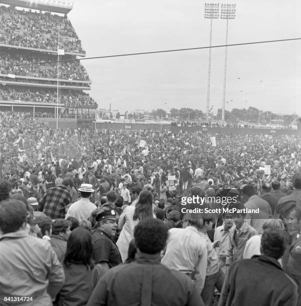 Shea Stadium : Fan appreciation spirals out of control, and dirt clods are thrown high into the air, as thousands of fans storm the field after the...