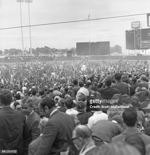 Shea Stadium : Thousands of fans storm the field, and partially knock down the back wall of Shea Stadium, as fan appreciation spirals out of control...