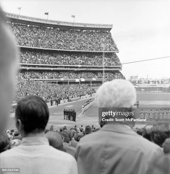 Shea Stadium : Over 57,000 fans rise to their feet, along with players and umpires, as the National Anthem is sung, just before the NY Mets and...