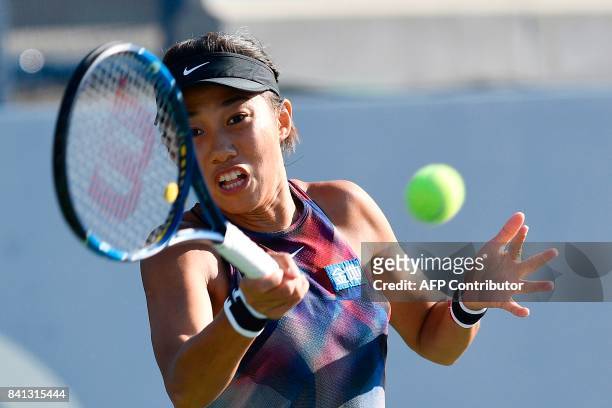 China's Shuai Zhang returns the ball to Japan's Risa Ozaki during their 2017 US Open Women's Singles match at the USTA Billie Jean King National...