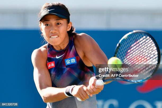 China's Shuai Zhang returns the ball to Japan's Risa Ozaki during their 2017 US Open Women's Singles match at the USTA Billie Jean King National...