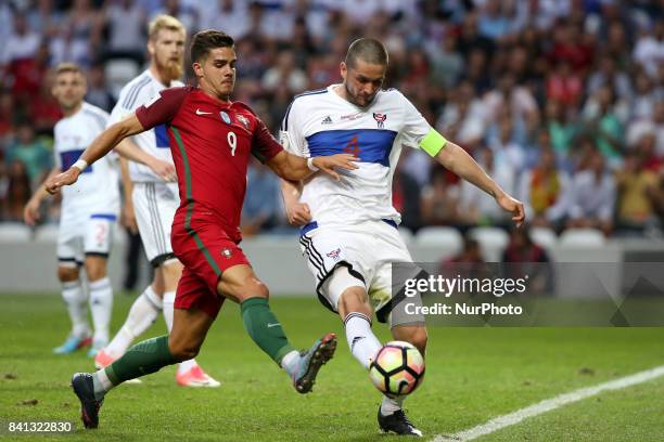 Portugal's forward Andre Silva vies with Faroe Islands' defender Atli Gregersen during the 2018 FIFA World Cup qualifying football match between...