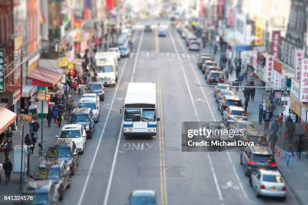 aerial view of chinatown during day with nyc bus - gray line new york sightseeing bus photos et images de collection