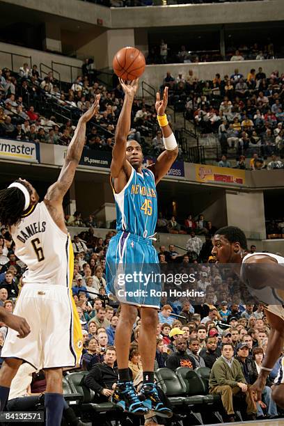 Rasual Butler of the New Orleans Hornets shoots over Marquis Daniels of the Indiana Pacers at Conseco Fieldhouse on December 28, 2008 in...