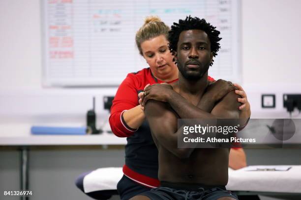 Wilfried Bony goes through his medical with club physiotherapist Kate Rees at the Swansea City FC Fairwood Training Ground on August 31, 2017 in...