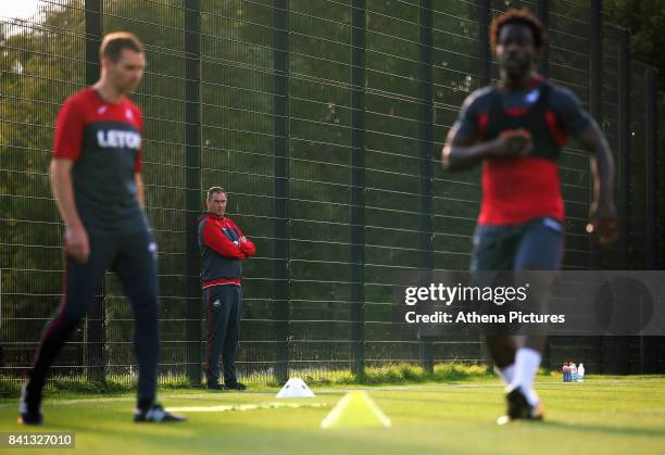 Manager Paul Clement watches on as Wilfried Bony goes through his medical at the Swansea City FC Fairwood Training Ground on August 31, 2017 in...