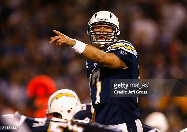 Quarterback Philip Rivers of the San Diego Chargers prepares to snap the ball during the NFL game against the Denver Broncos at Qualcomm Stadium on...