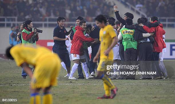 Vietnamese players celebrate behind dejected Thai players after Vietnam won the AFF Suzuki Cup final between Vietnam and Thailand on December 28,...