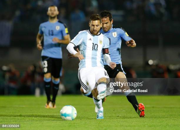 Lionel Messi of Argentina fights for the ball with Alvaro Gonzalez of Uruguay during a match between Uruguay and Argentina as part of FIFA 2018 World...