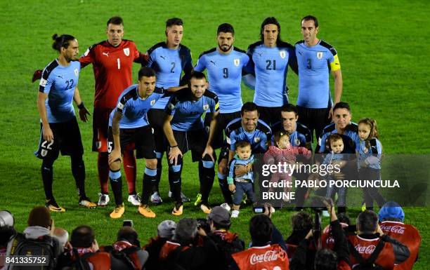 Players of Uruguay pose for pictures before the start of their 2018 World Cup football qualifier match against Argentina in Montevideo, on August 31,...