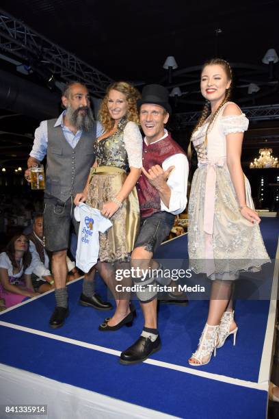 Peer Kusmagk, his girlfriend Janni Hoenscheid, Senay Gueler and Joelina Drews during the Angermaier Trachten-Nacht at Hofbraeuhaus on August 31, 2017...