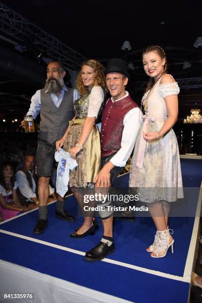 Peer Kusmagk, his girlfriend Janni Hoenscheid, Senay Gueler and Joelina Drews during the Angermaier Trachten-Nacht at Hofbraeuhaus on August 31, 2017...