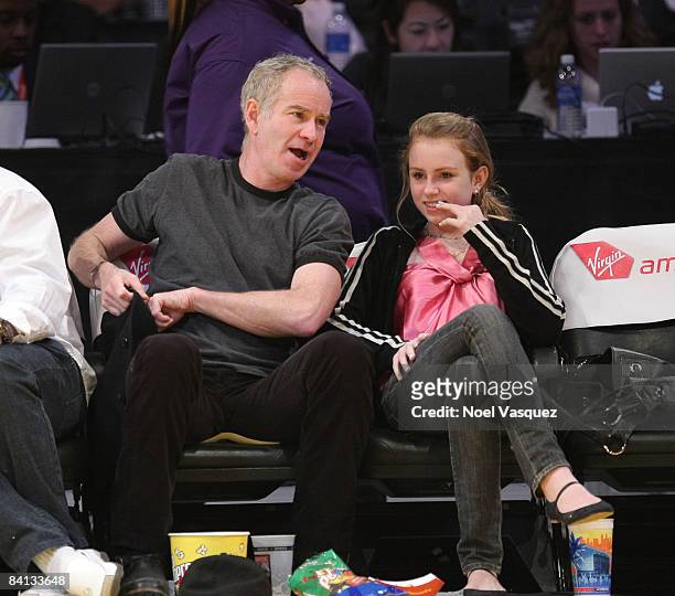 John McEnroe and Ava McEnroe attend the Los Angeles Lakers vs Golden State Warriors game at the Staples Center on December 28, 2008 in Los Angeles,...