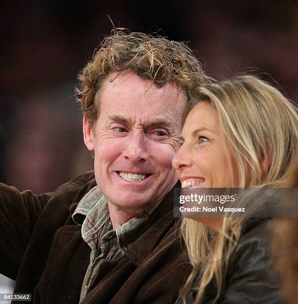 John C. McGinley and Nichole Kessler attend the Los Angeles Lakers vs Golden State Warriors game at the Staples Center on December 28, 2008 in Los...