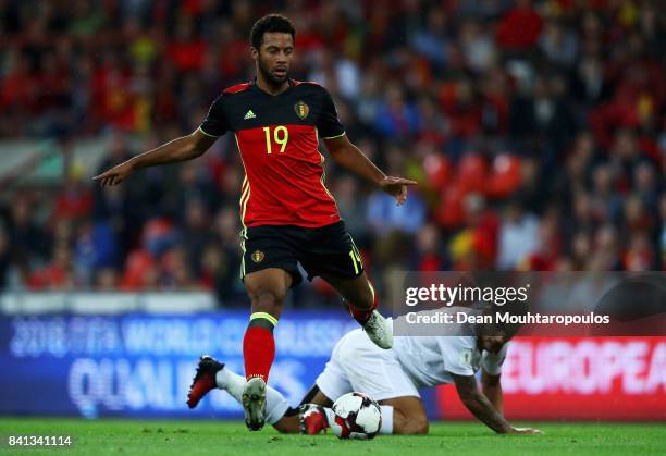 Mousa Dembele of Belgium gets past the tackle from Joseph Chipolina of Gibraltar during the FIFA 2018 World Cup Qualifier between Belgium and...