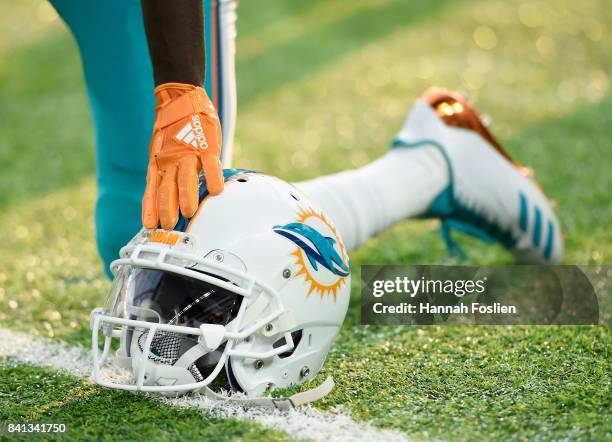 The helmet of Jakeem Grant of the Miami Dolphins is seen as he takes a knee during warmups before the preseason game against the Minnesota Vikings on...