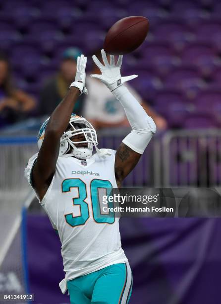 Cordrea Tankersley of the Miami Dolphins warms up before the preseason game against the Minnesota Vikings on August 31, 2017 at U.S. Bank Stadium in...