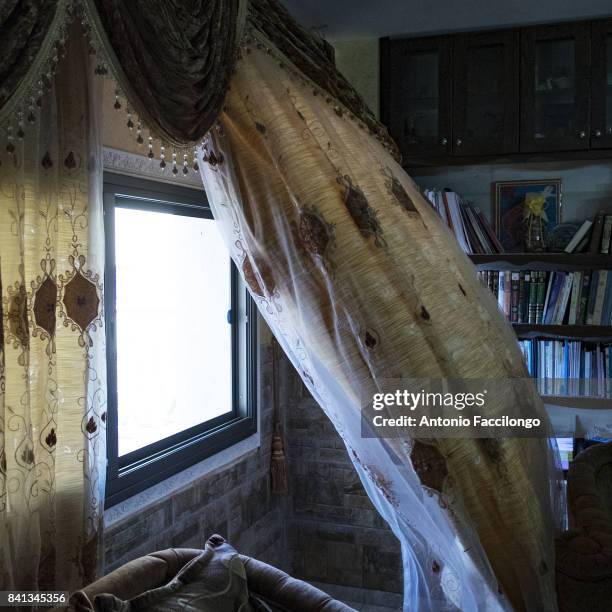 Bethlehem, Palestine A tent drift by in the wind in the Hanadi Moussa Moghrabi house. She has twins, Nour and Sondus born through IVF. Her husband...