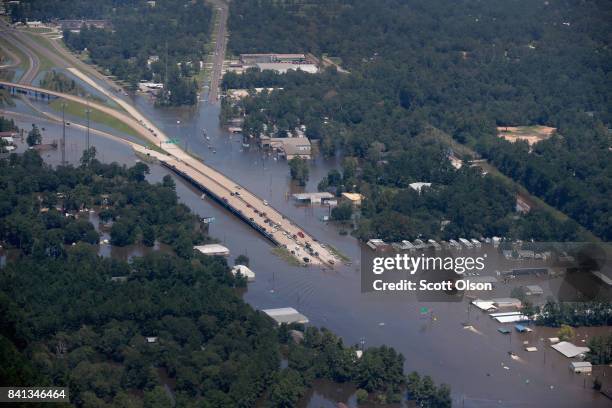 Road is covered by floodwater left in the wake of Hurricane and Tropical Storm Harvey on August 31, 2017 near Houston, Texas. Harvey, which made...