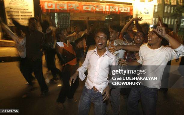 Supporters of Bangladesh's Awami League Party celebrate in Dhaka on December 29 as news of early poll trends show their party are in the lead in...