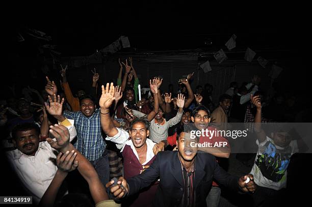 Supporters of Bangladesh's Awami League Party celebrate in Dhaka on December 29 as news of early poll trends show their party are in the lead in...