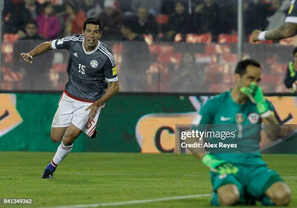 Victor Caceres of Paraguay celebrates after scoring the second, goal his team during a match between Chile and Paraguay as part of FIFA 2018 World...